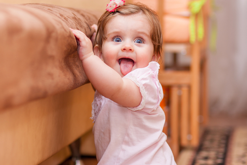 Baby walking around sales furniture